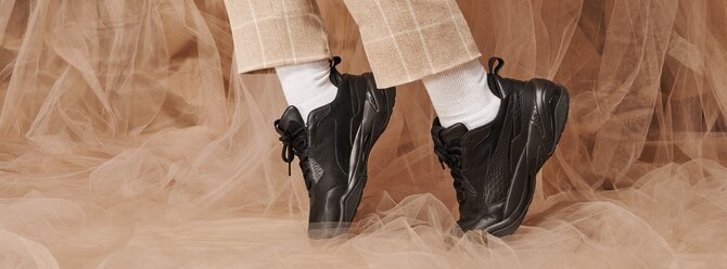 Person wearing Puma trainers